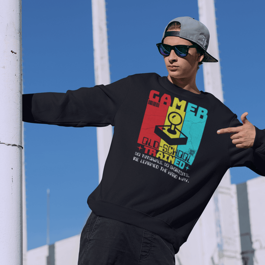 Child wearing youth gaming sweatshirt with retro arcade design and bold typography, fun gamer apparel by LostLogicCo Canada