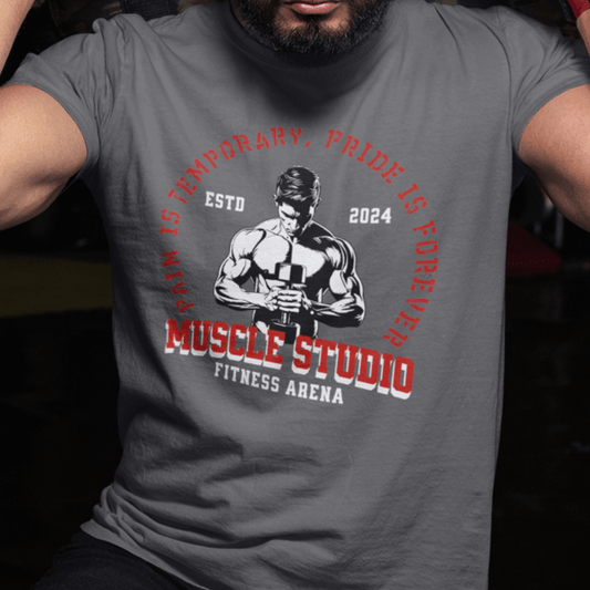 Model wearing “Muscle Studio Fitness Arena” motivational gym t-shirt with weightlifter illustration, unisex cotton tee by LostLogicCo Canada