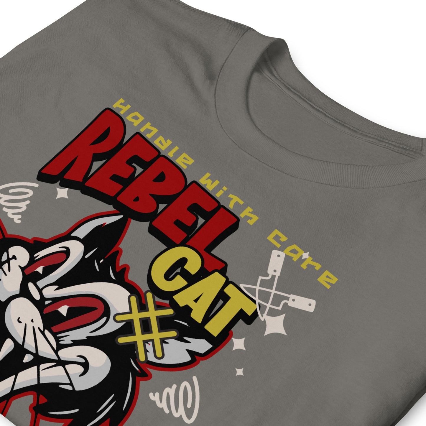Unisex t-shirt with bold cartoon cat design and “Rebel Cat” text, edgy streetwear graphic tee by LostLogicCo Canada