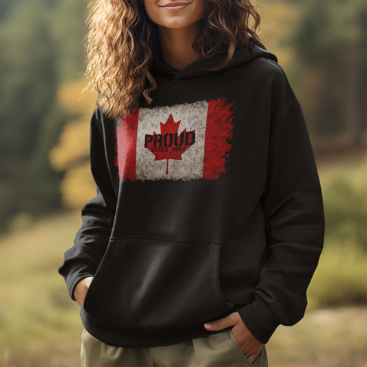Model wearing black hoodie featuring Canadian flag maple leaf “Proud” design, unisex patriotic streetwear by LostLogicCo Canada