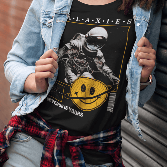 Youth wearing “Galaxies” kids astronaut t-shirt with cosmic design, sporty moisture-wicking youth tee by LostLogicCo Canada