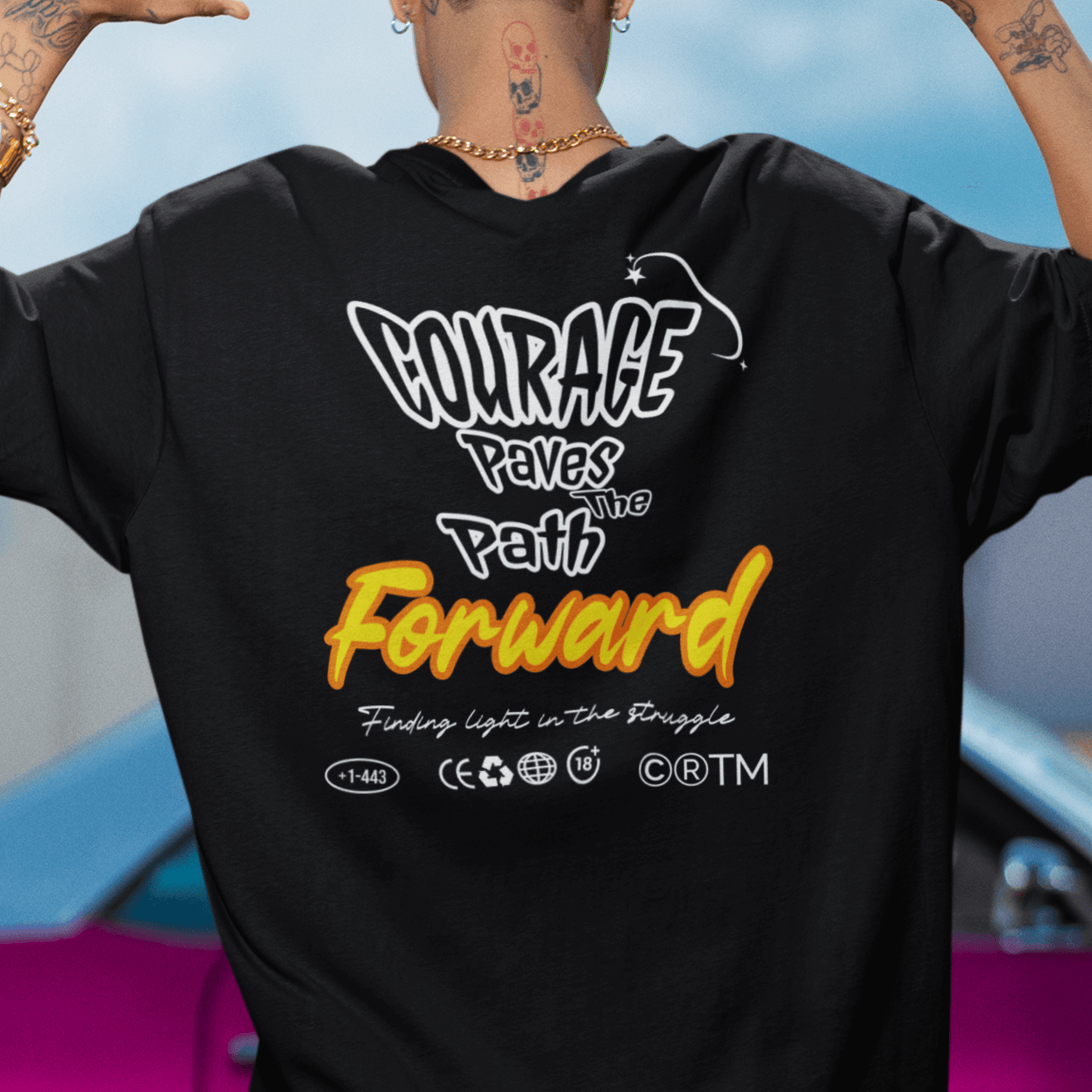 Model showing back design “Courage Paves the Path Forward” on unisex t-shirt, motivational back print tee by LostLogicCo Canada