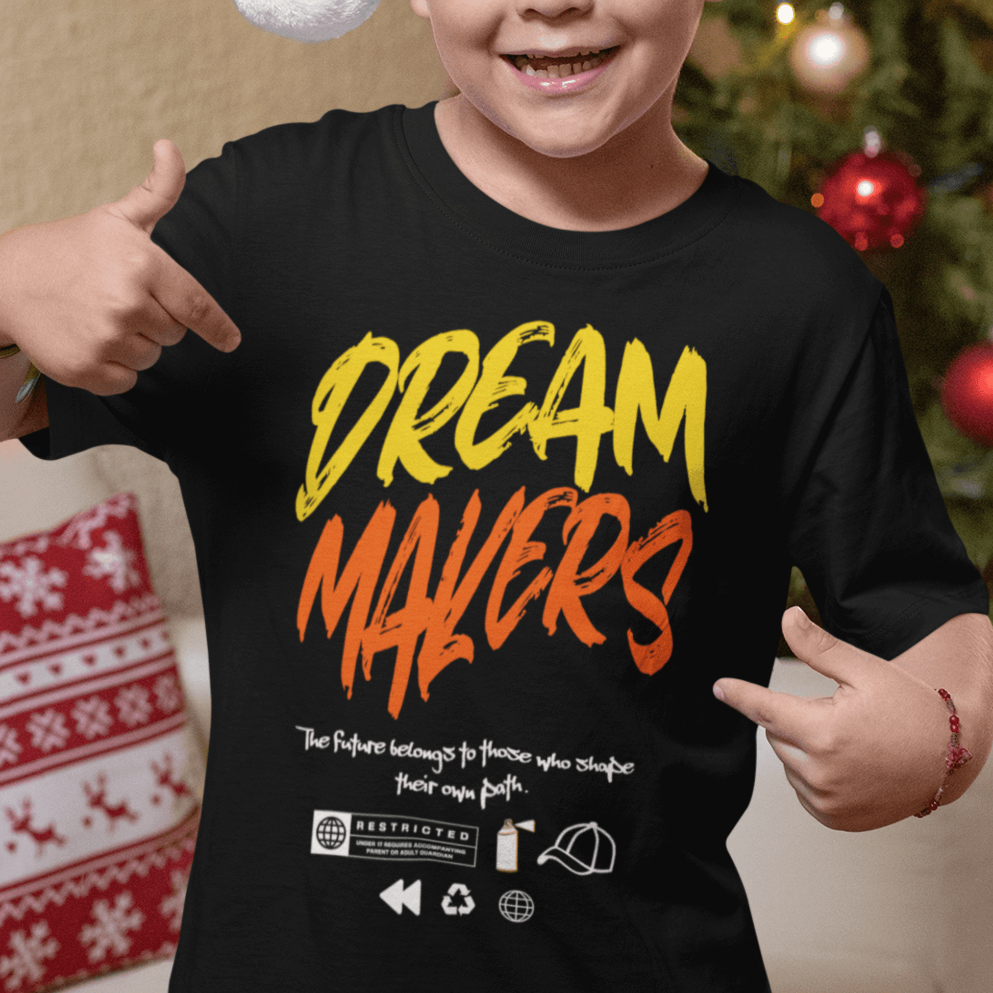 Child wearing “Dream Makers” motivational typography t-shirt, soft cotton youth tee by LostLogicCo Canada