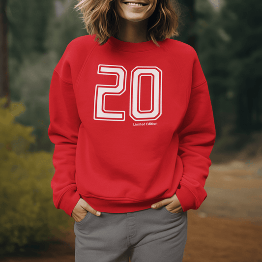 Model wearing red crewneck sweatshirt featuring bold outlined “20” number design, unisex minimal streetwear by LostLogicCo Canada