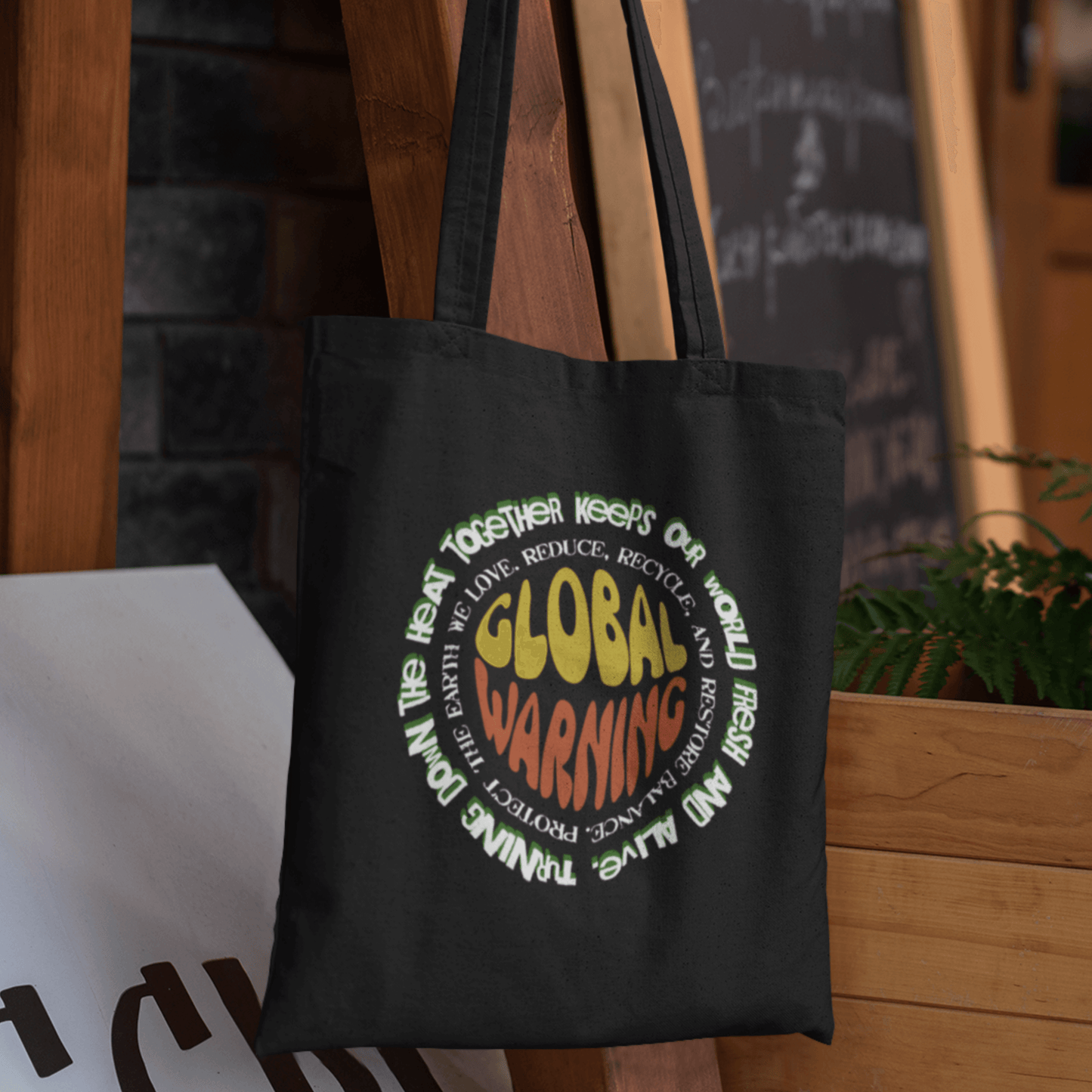 Organic cotton tote bag with “Global Warning” retro environmental typography design by LostLogicCo Canada.