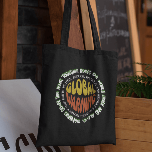 Organic cotton tote bag with “Global Warning” retro environmental typography design by LostLogicCo Canada.