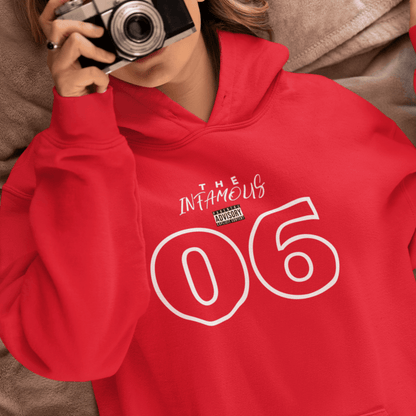 Female Model wearing red hoodie featuring white outlined “06” and stylish upper-text graphic, minimal streetwear by LostLogicCo Canada