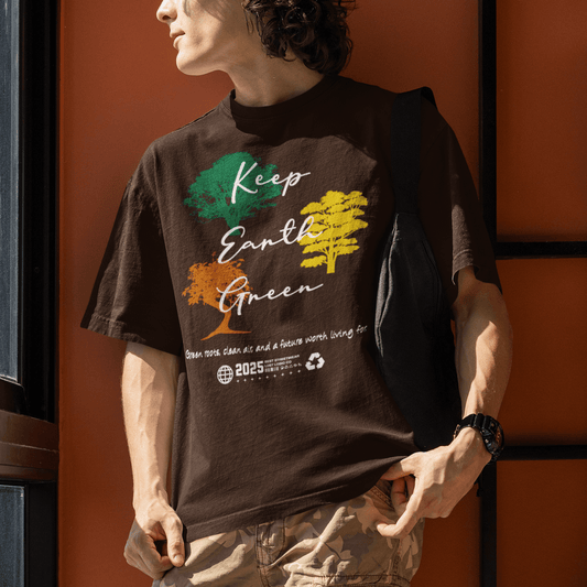 Model wearing “Keep Earth Green” unisex t-shirt with tree artwork and environmental message, soft cotton tee by LostLogicCo Canada