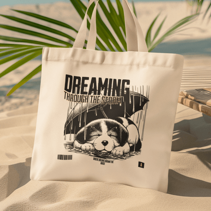 Eco tote bag with “Dreaming Through the Storm” design showing a sleeping puppy under an umbrella, printed on organic cotton by LostLogicCo Canada.