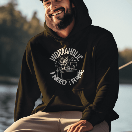 Model wearing a black, Workaholic I Need a Raise hoodie with illustrated work humor design