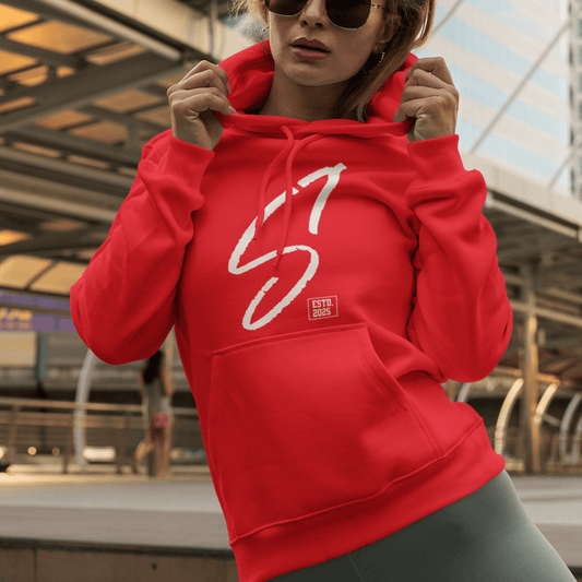 Female Model wearing red hoodie featuring bold minimal “S1” signature graphic, modern streetwear design by LostLogicCo Canada
