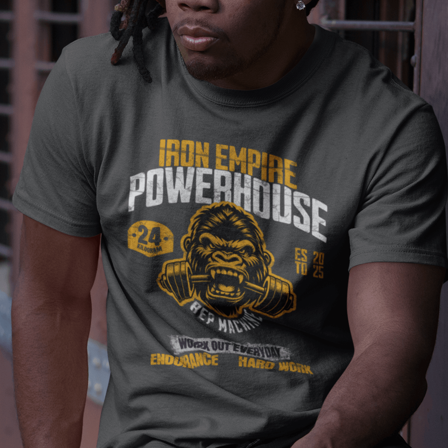 Model wearing unisex gym graphic t-shirt with “Iron Empire Powerhouse” gorilla design, casual cotton tee by LostLogicCo Canada