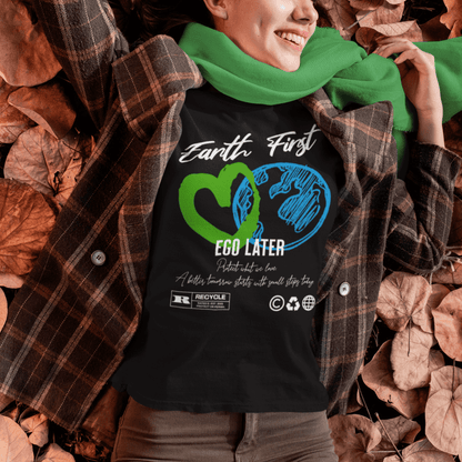 Model wearing “Earth First Ego Later” eco-awareness t-shirt with green heart and planet design, unisex cotton tee by LostLogicCo Canada