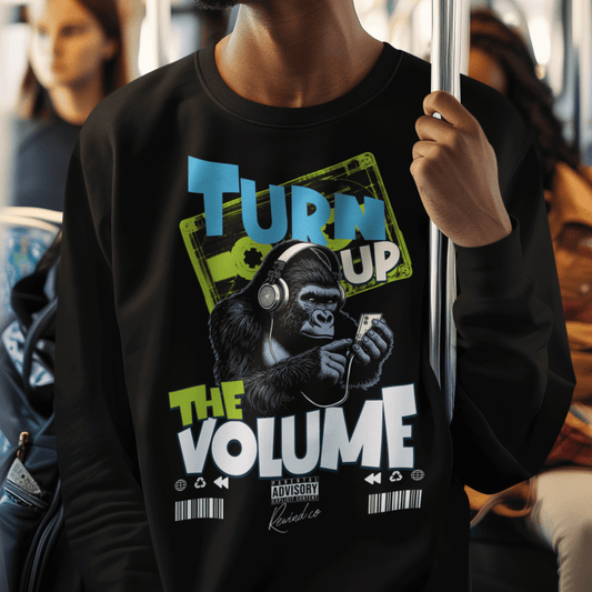 Model wearing unisex music graphic sweatshirt with “Turn Up the Volume” gorilla design, casual crewneck by LostLogicCo Canada