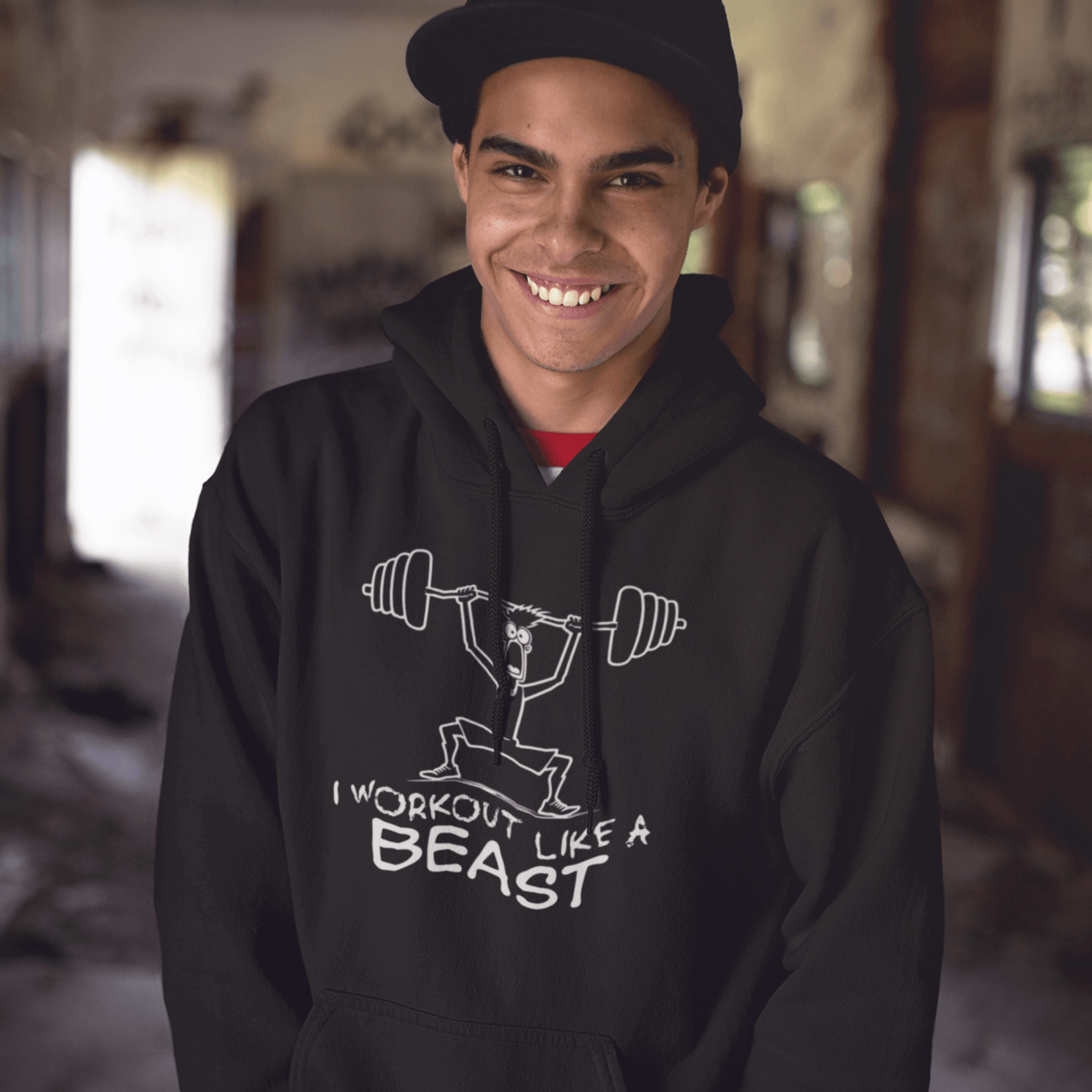 Model wearing black hoodie featuring weightlifter illustration and “I Workout Like a Beast” typography, unisex fitness streetwear by LostLogicCo Canada