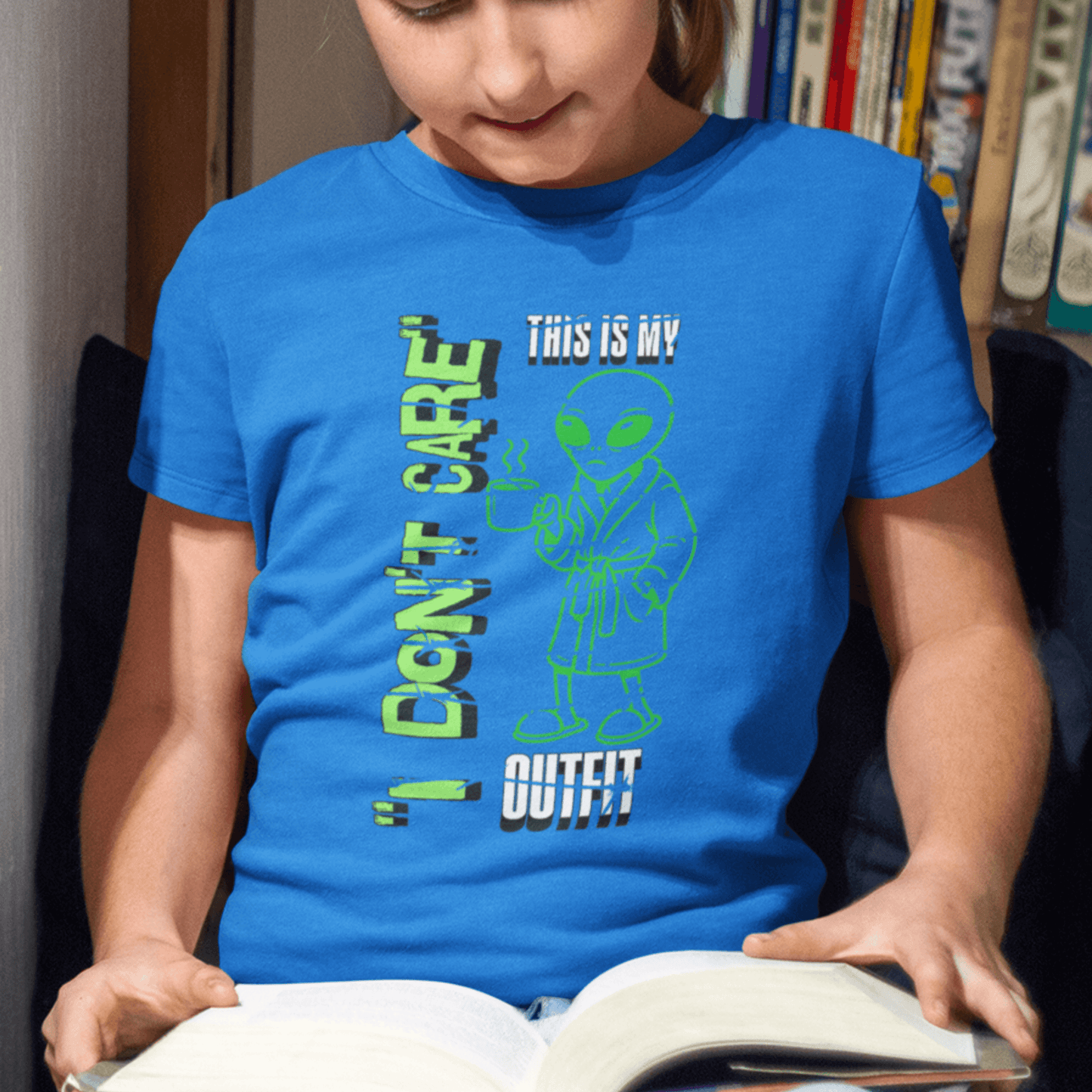 Child wearing youth graphic t-shirt with “I Don’t Care Alien” design, casual short sleeve tee by LostLogicCo Canada