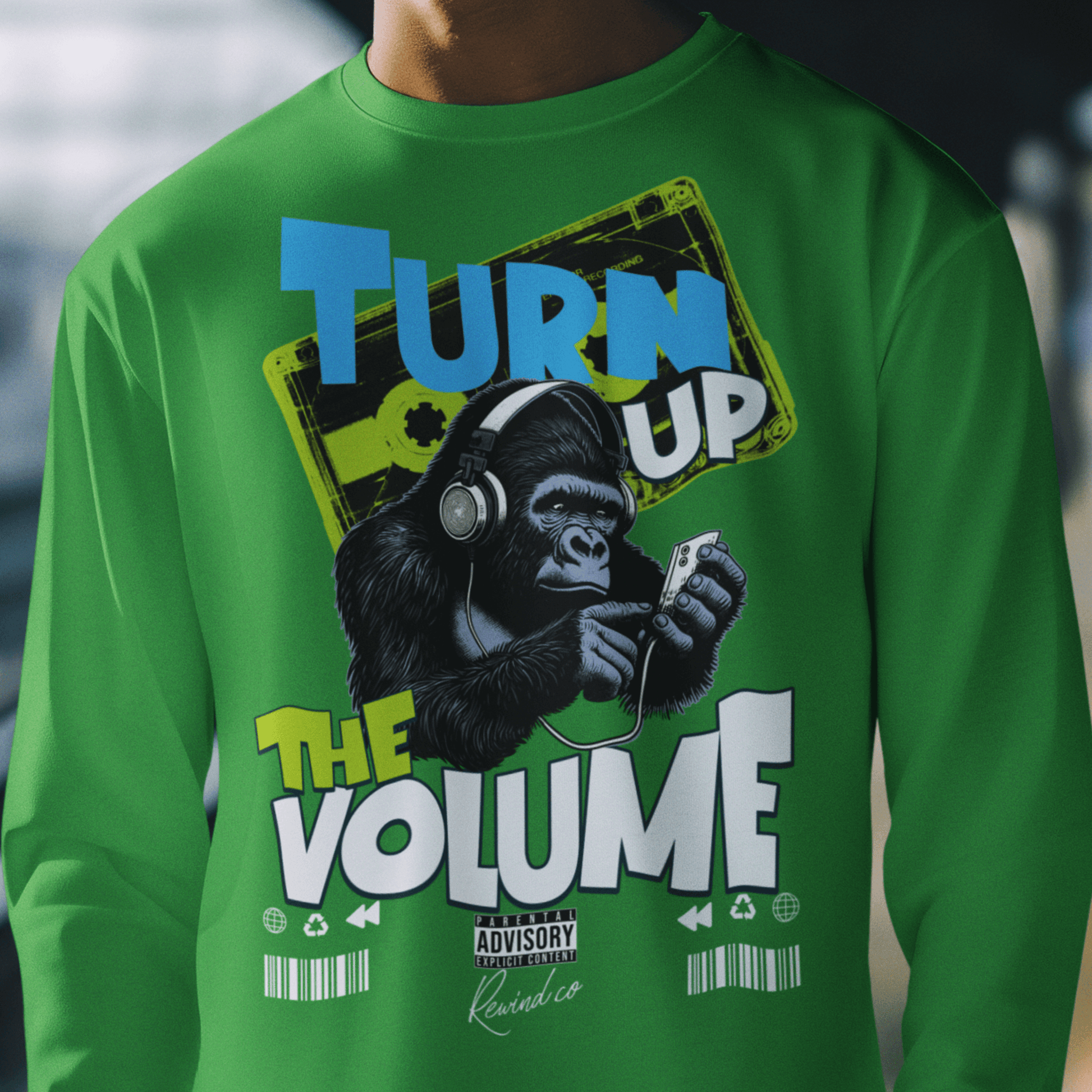 Model wearing unisex music graphic sweatshirt with “Turn Up the Volume” gorilla design, casual crewneck by LostLogicCo Canada