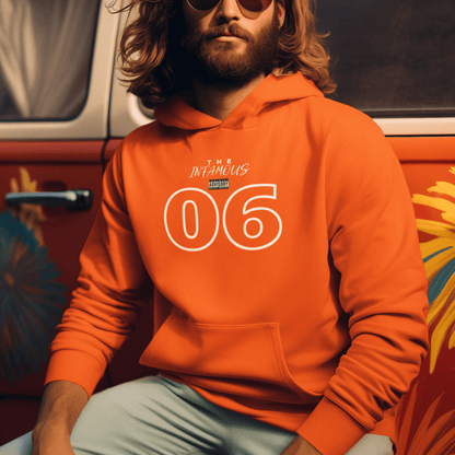 Male Model wearing orange hoodie featuring white outlined “06” and stylish upper-text graphic, minimal streetwear by LostLogicCo Canada