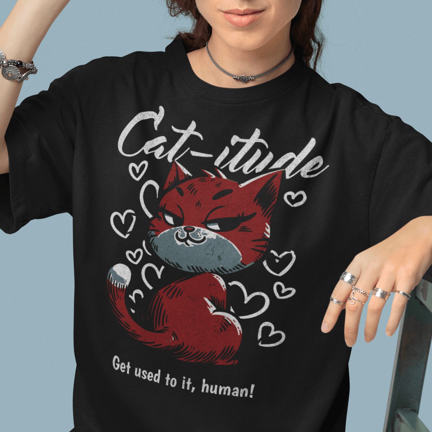 Model wearing “Cat-itude Get Used to It Human” funny cat t-shirt with red cat graphic and bold typography, unisex sports tee by LostLogicCo Canada