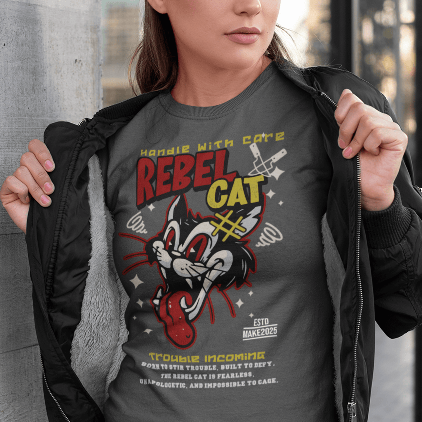 Person wearing “Rebel Cat” t-shirt featuring wild cartoon feline graphic, unisex soft cotton streetwear tee by LostLogicCo Canada