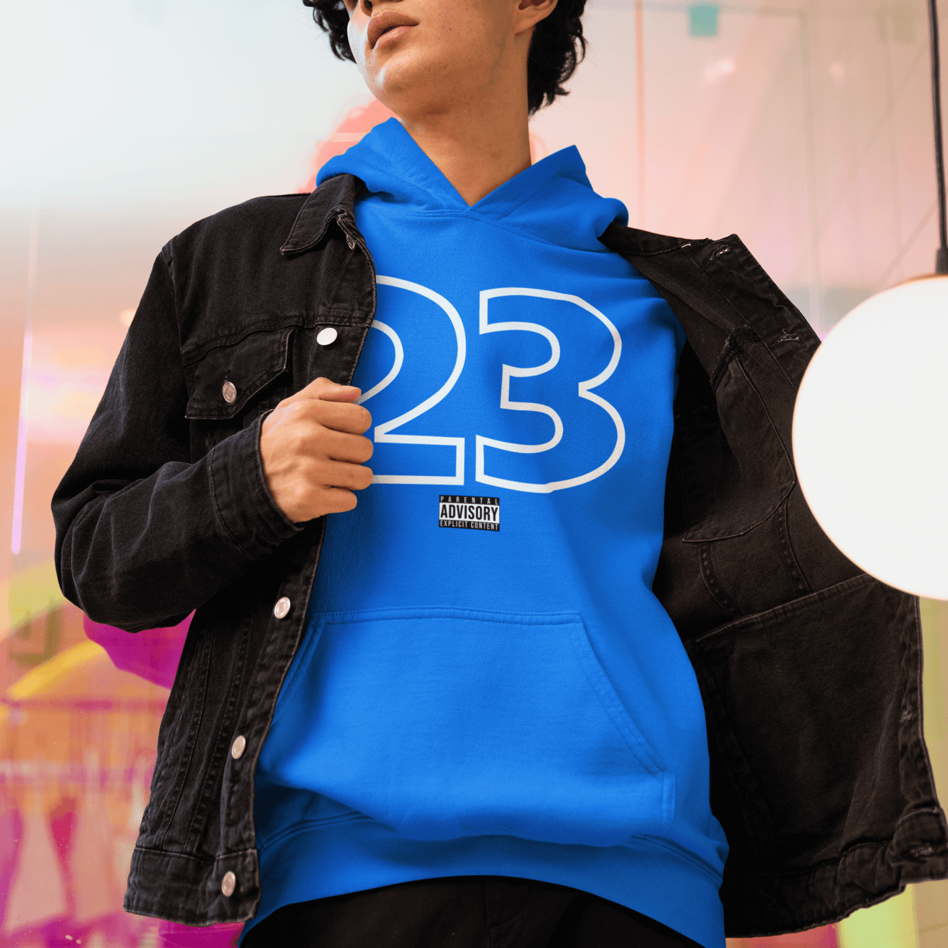 Male Model wearing blue hoodie with outlined “23” numeric graphic, minimal streetwear design by LostLogicCo Canada