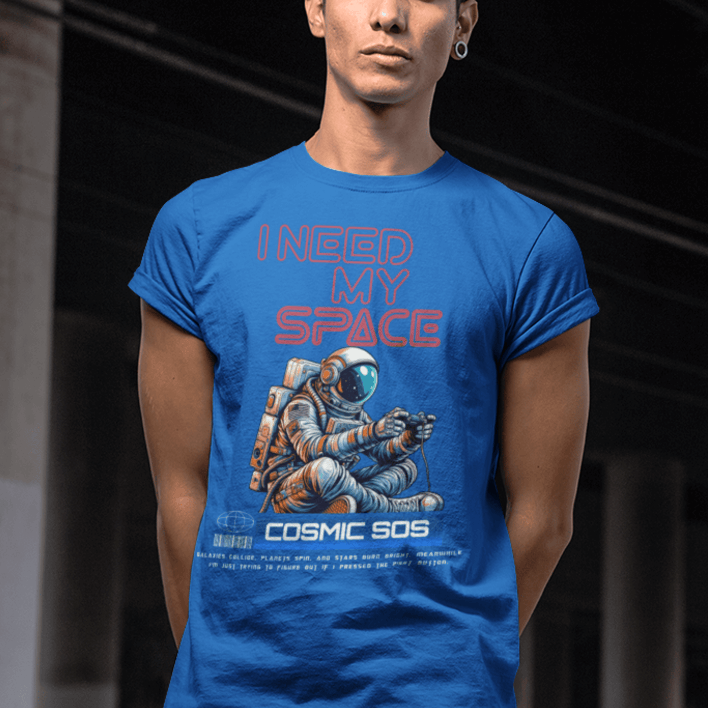 Model wearing “I Need My Space Cosmic SOS” astronaut design t-shirt, black unisex cotton tee by LostLogicCo Canada