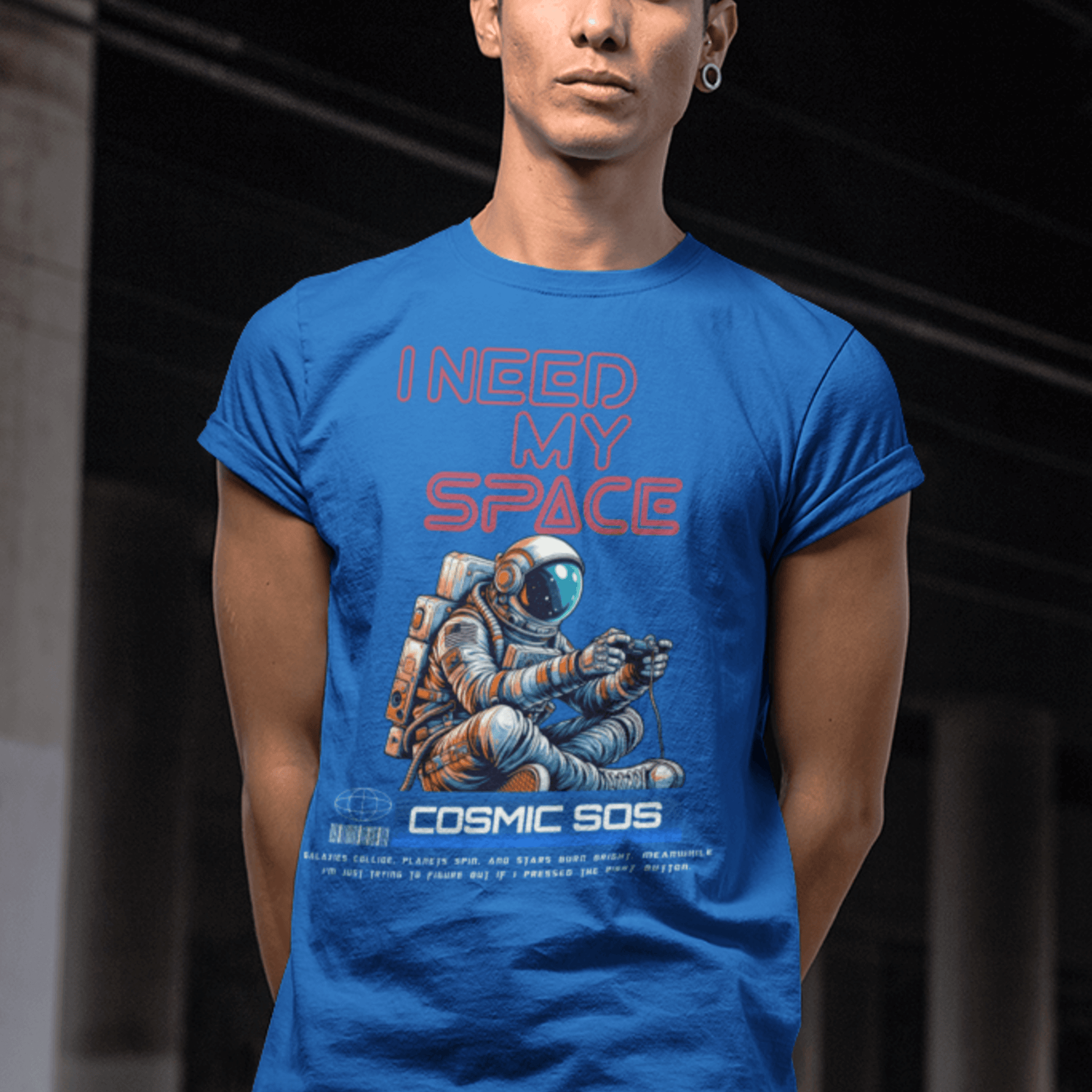 Model wearing “I Need My Space Cosmic SOS” astronaut design t-shirt, black unisex cotton tee by LostLogicCo Canada