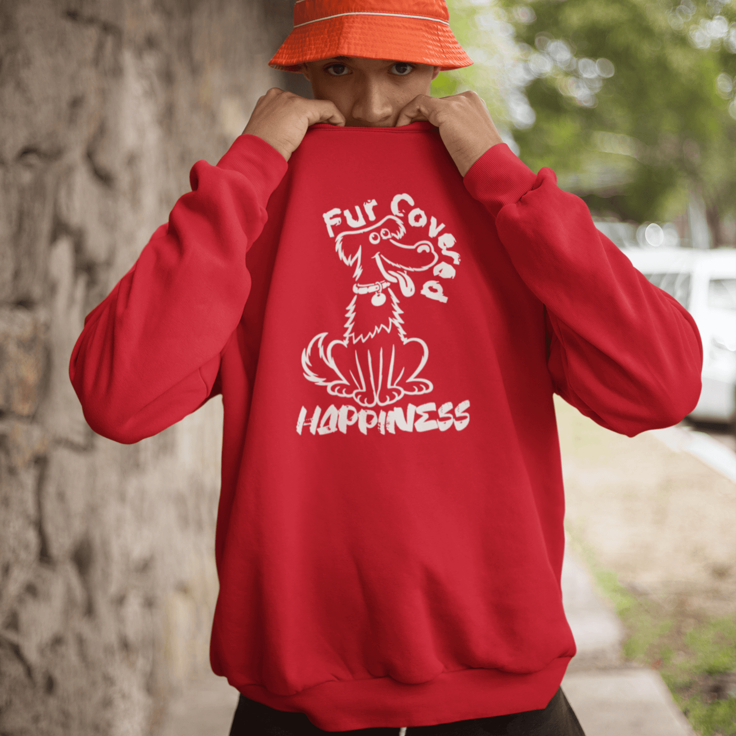 Model wearing a red Fur Covered Happiness sweatshirt with cute dog illustration design