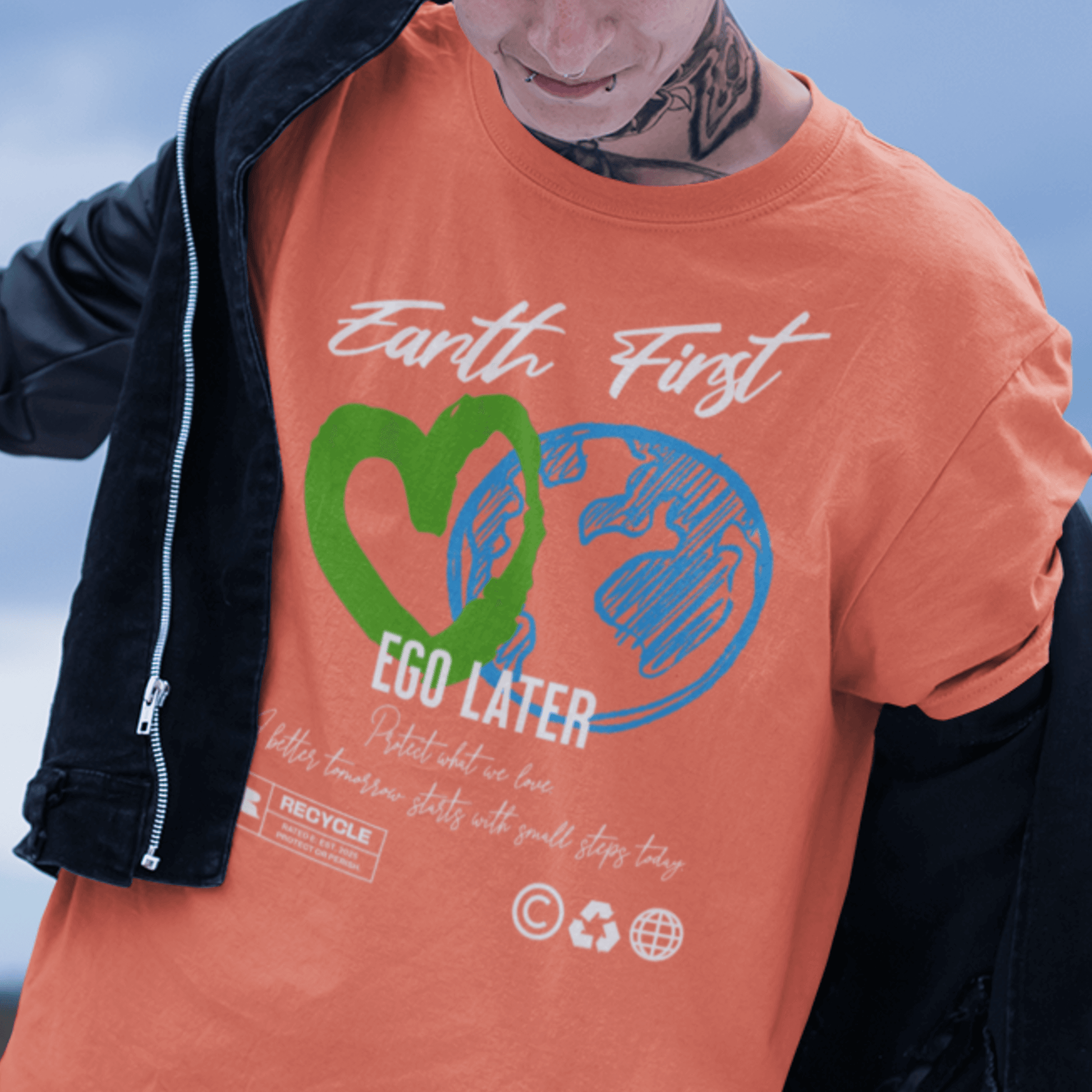 Model wearing “Earth First Ego Later” eco-awareness t-shirt with green heart and planet design, unisex cotton tee by LostLogicCo Canada