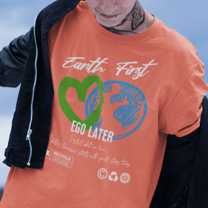 Model wearing “Earth First Ego Later” eco-awareness t-shirt with green heart and planet design, unisex cotton tee by LostLogicCo Canada