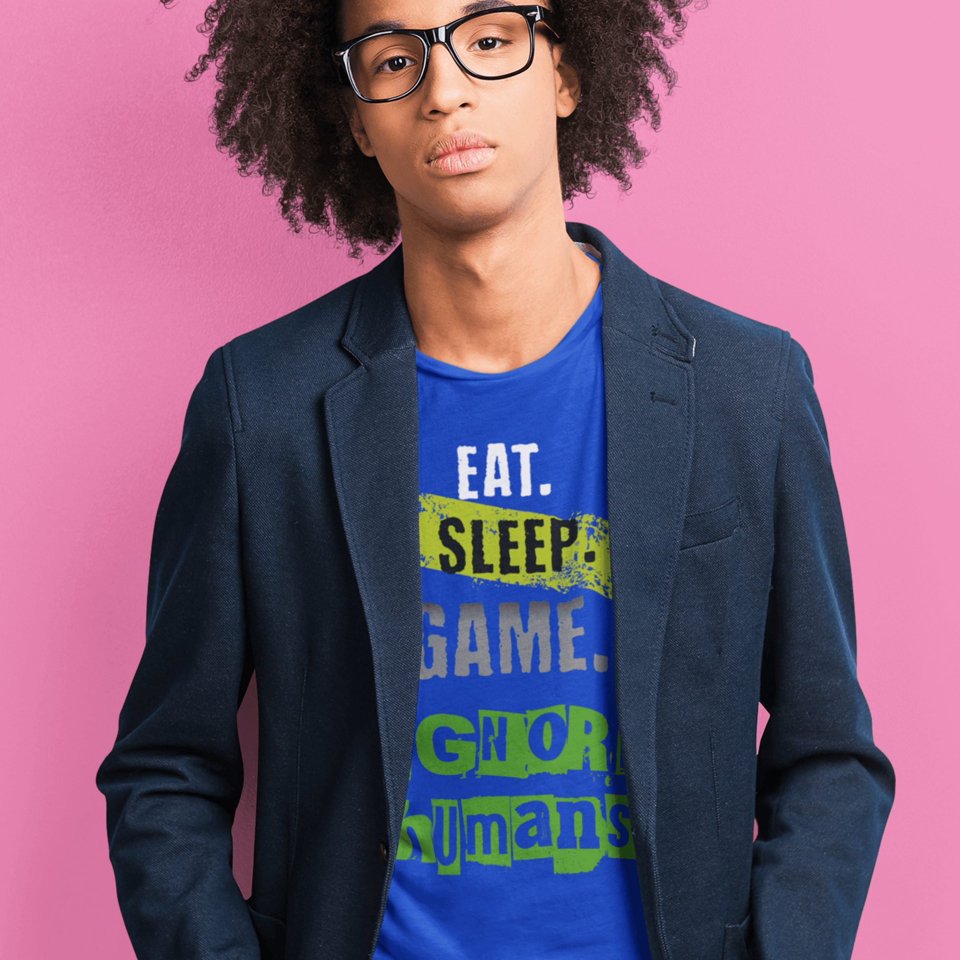 Model wearing unisex gamer typography t-shirt with “Eat Sleep Game Ignore Humans” design, casual short sleeve tee by LostLogicCo Canada