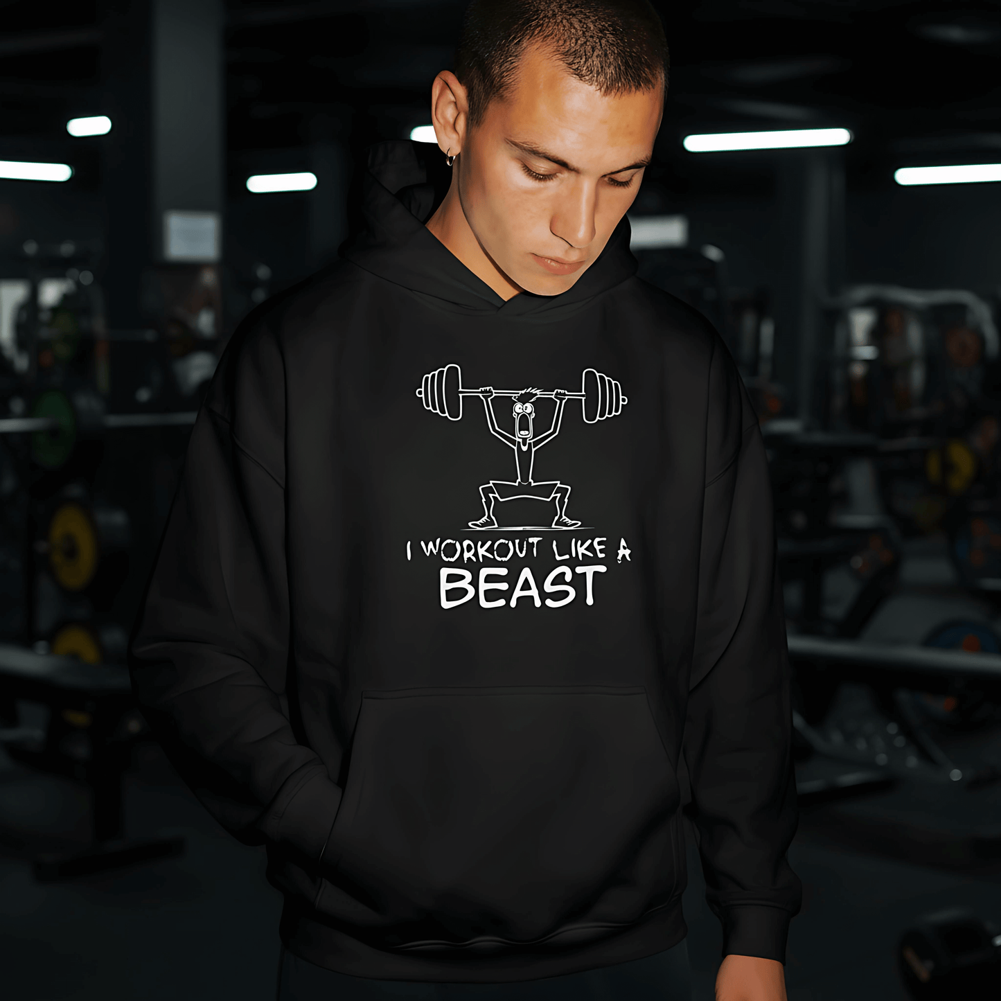 Model wearing black hoodie featuring weightlifter illustration and “I Workout Like a Beast” typography, unisex fitness streetwear by LostLogicCo Canada