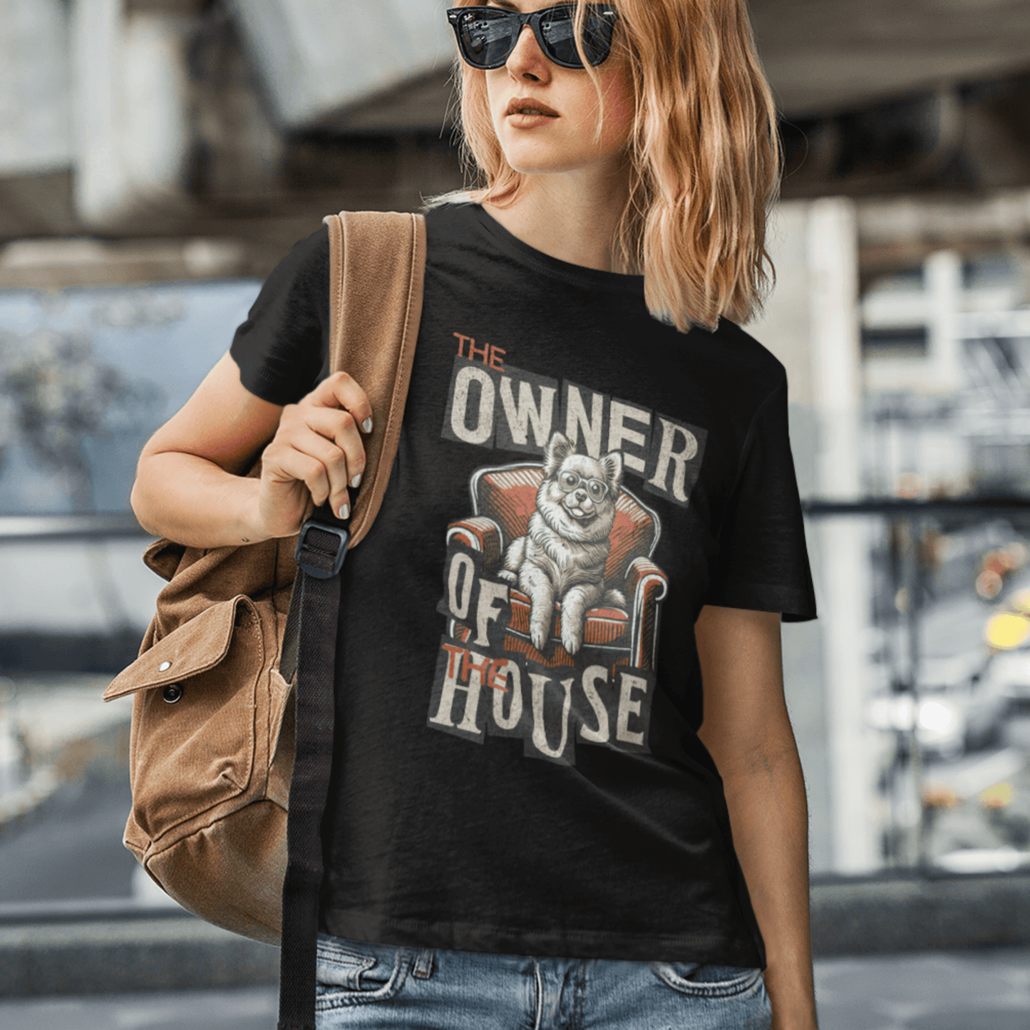 Model wearing unisex dog graphic t-shirt with “Owner of the House” design, casual soft cotton tee by LostLogicCo Canada