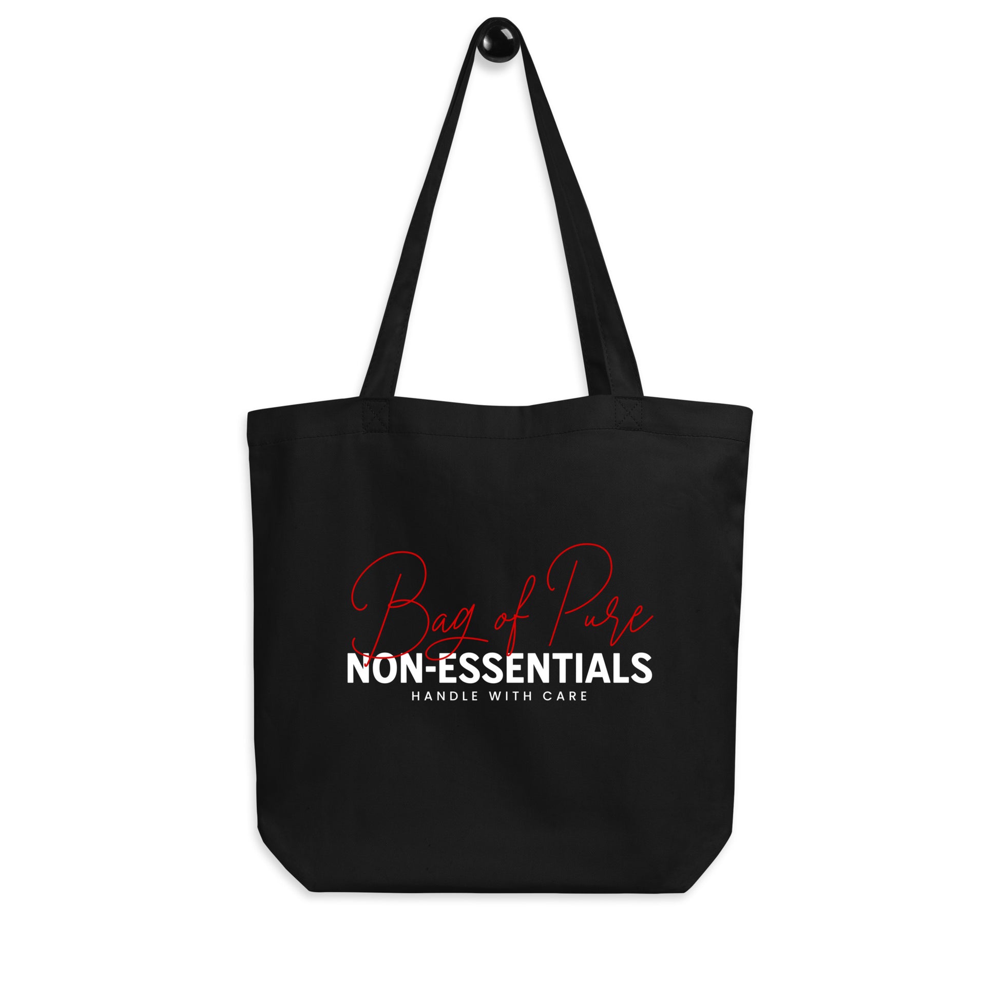 Eco tote bag with “Bag of Pure Non-Essentials Handle with Care” typography design in red and white on black organic cotton by LostLogicCo Canada.