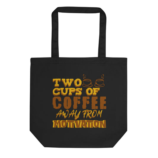 Eco tote bag with “Two Cups of Coffee Away from Motivation” typography design in brown and yellow on black organic cotton by LostLogicCo Canada.