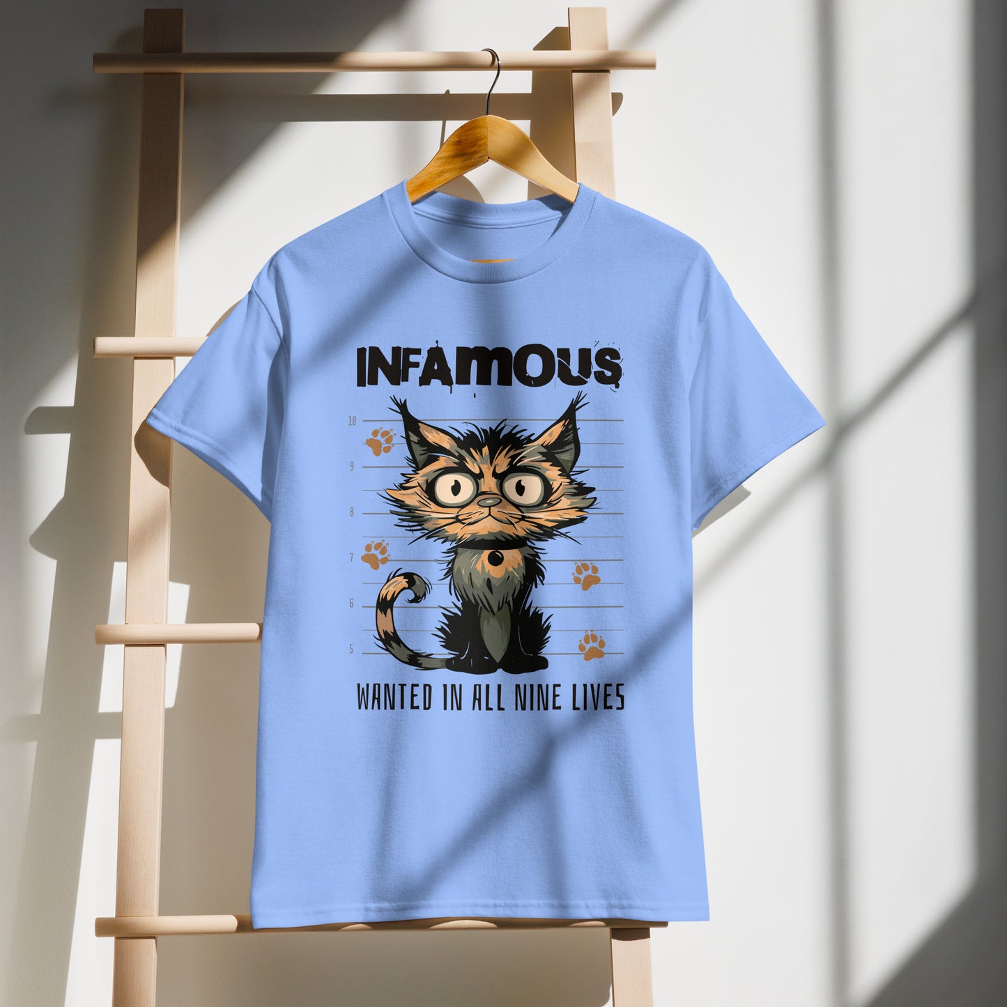 Unisex t-shirt with cartoon cat mugshot and “Infamous Cat” text, funny animal graphic tee by LostLogicCo Canada