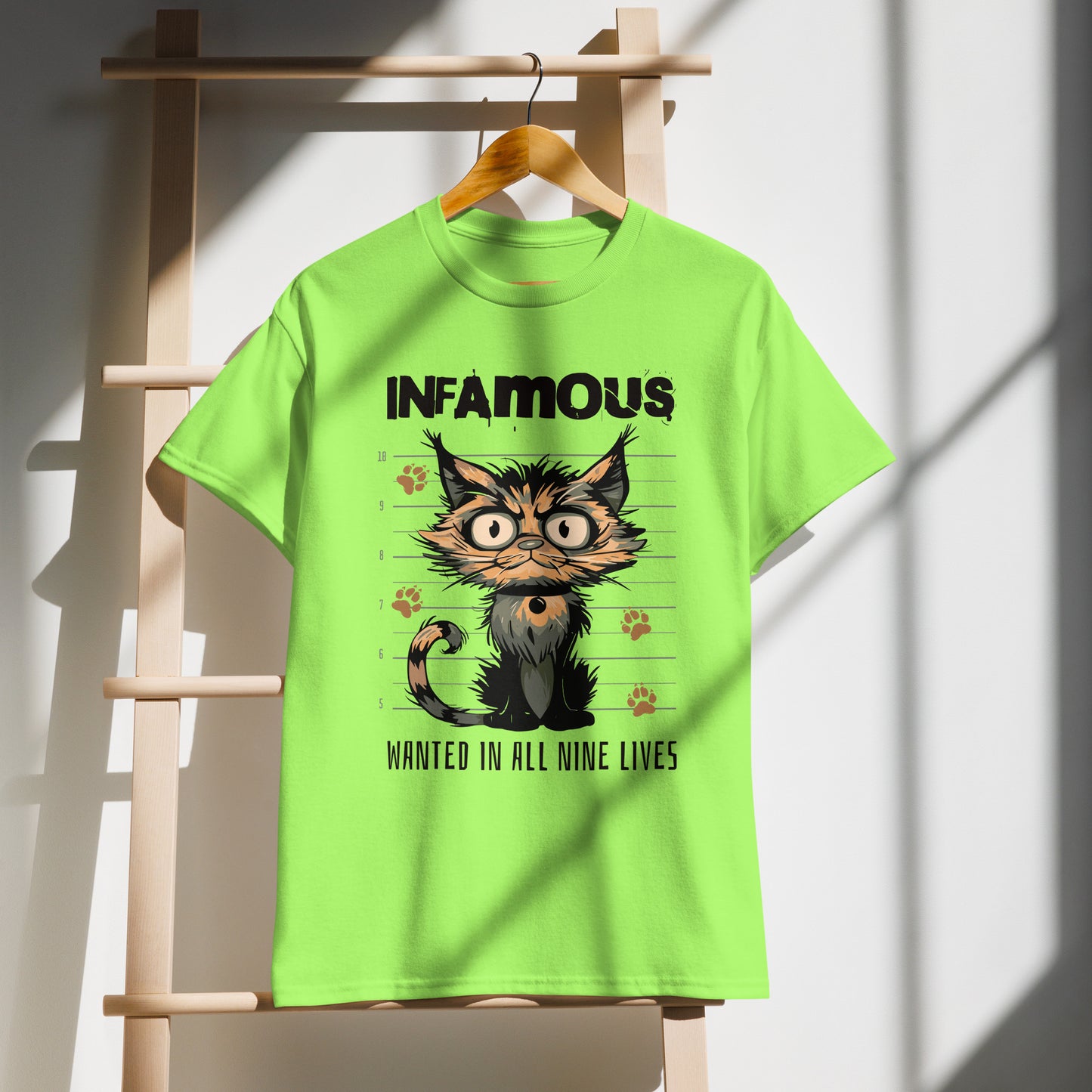 Unisex t-shirt with cartoon cat mugshot and “Infamous Cat” text, funny animal graphic tee by LostLogicCo Canada